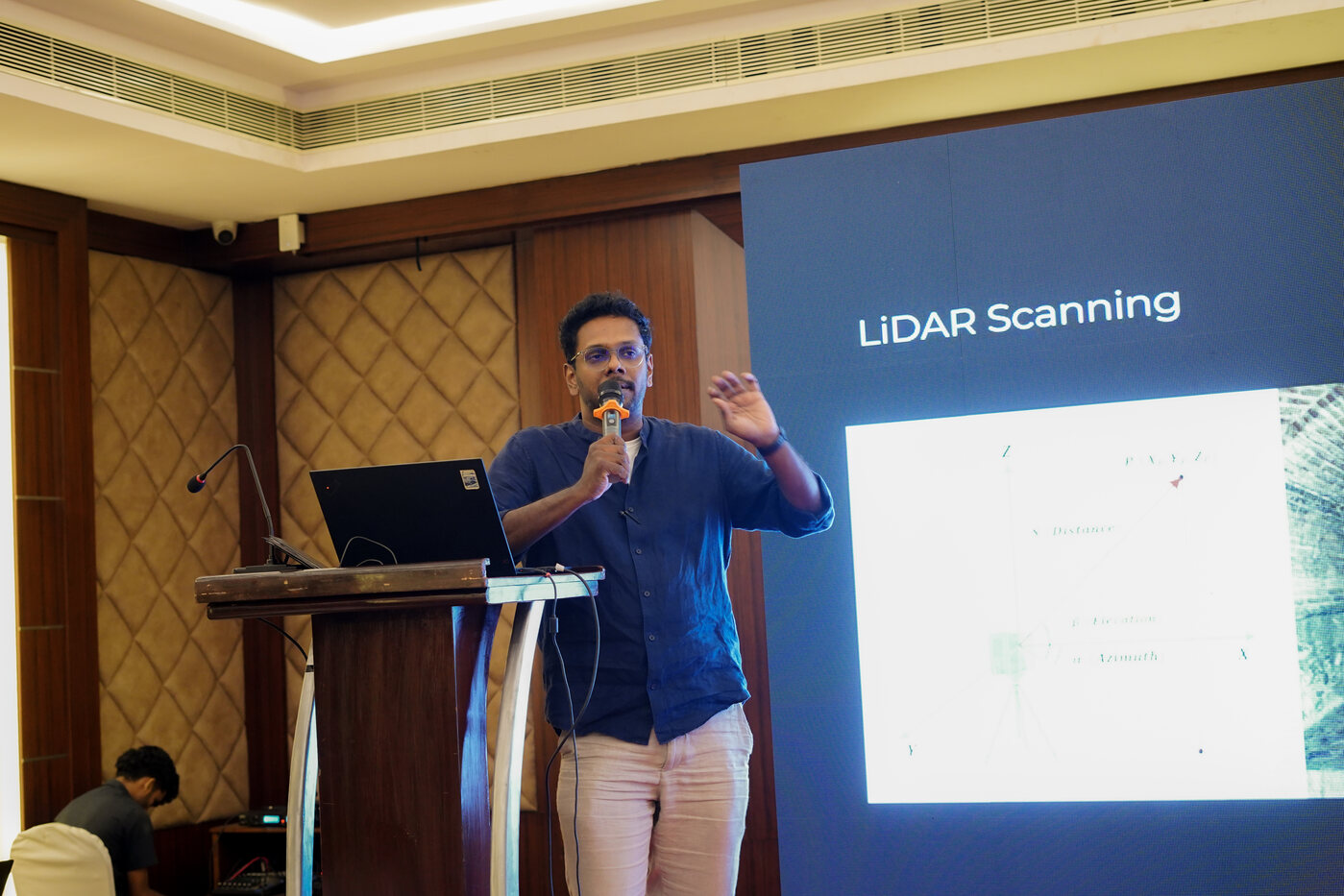 A trainer presenting a session on LiDAR scanning to a seated audience