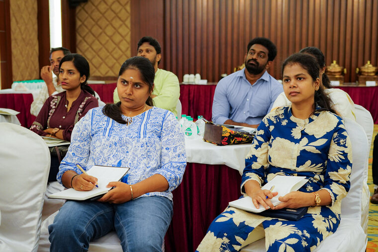 Participants making notes during a Bumblebee Inc training session